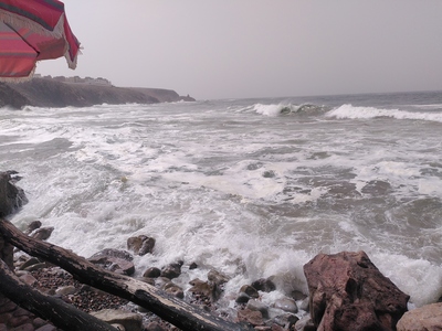 The rough Atlantic ocean in a picture taken from a balcony which the sea visits at high tide.